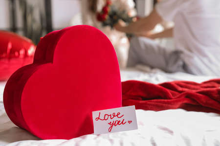 Gift for Valentine's Day on bed in the morningの写真素材