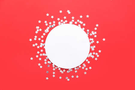 Beautiful confetti and blank card on red backgroundの写真素材