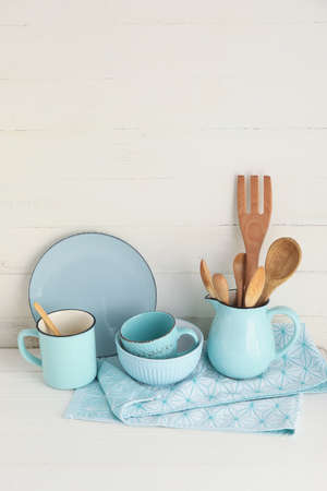 Set of stylish tableware on light wooden backgroundの写真素材