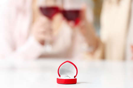 Box with engagement ring on tableの写真素材