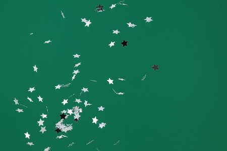 Beautiful confetti on green backgroundの写真素材