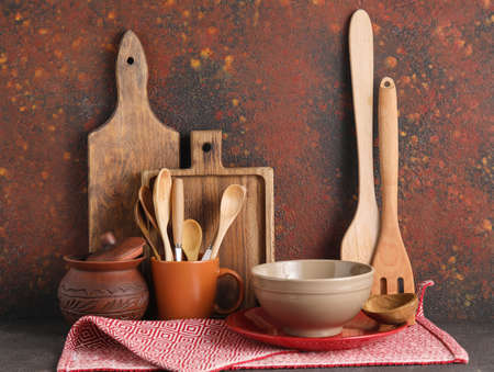 Set of stylish tableware on grunge background