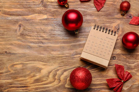 Craft calendar and Christmas decor on wooden backgroundの写真素材