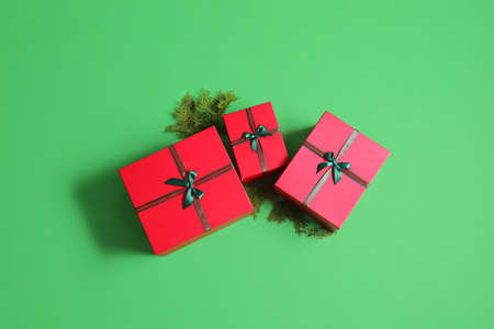 Beautiful Christmas gift boxes on green backgroundの写真素材