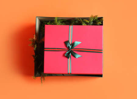Beautiful Christmas gift boxes on orange backgroundの写真素材