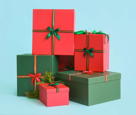 Beautiful Christmas gift boxes on blue background