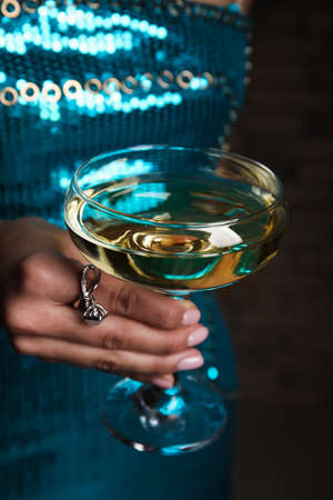 Woman in beautiful dress holding glass of champagne, closeupの写真素材