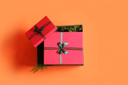 Beautiful Christmas gift boxes on orange backgroundの写真素材