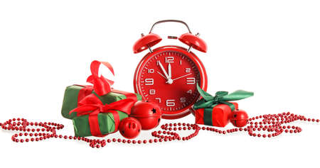Stylish alarm clock, gift boxes and Christmas decor on white background