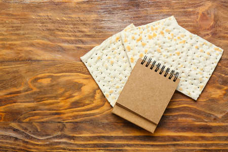 Blank craft calendar and crackers on wooden backgroundの写真素材