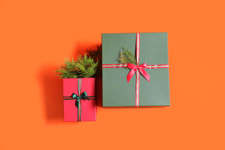 Beautiful Christmas gift boxes on orange backgroundの写真素材