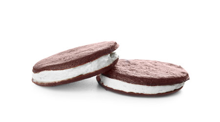 Tasty chocolate cookies with cream on white backgroundの写真素材