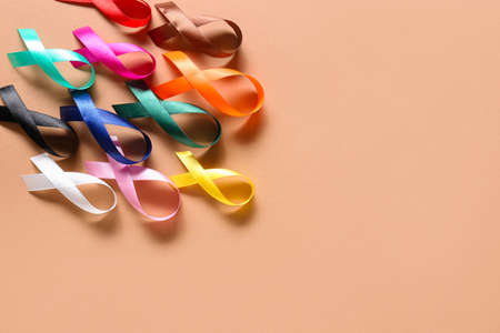 Many different awareness ribbons on color background. World Cancer Dayの写真素材