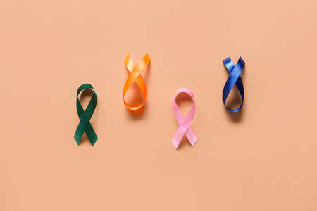 Colorful awareness ribbons on color background. World Cancer Dayの写真素材