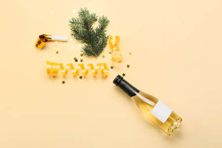 Composition with bottle of champagne and Christmas decor on color background
