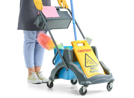 Worker of cleaning service with trolley on white background