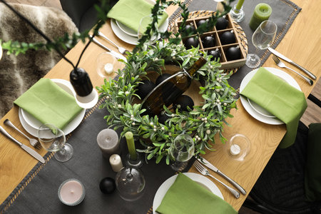 Elegant table setting for Easter dinner in living room, top view