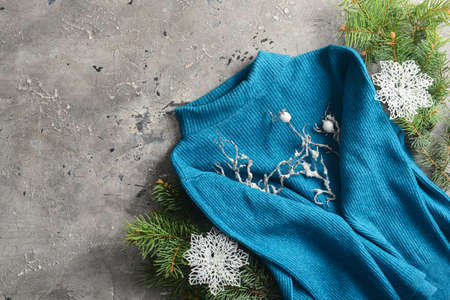 Female sweater and Christmas decor on grunge backgroundの写真素材