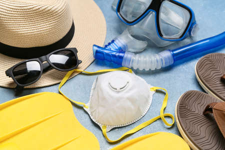 Equipment for snorkeling, accessories and medical mask on color background