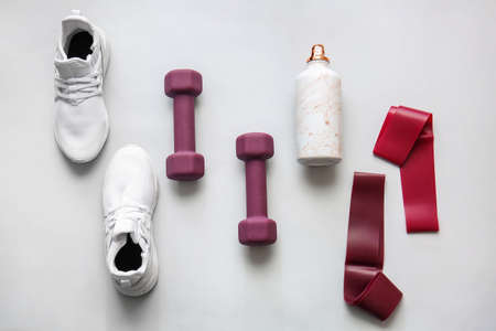 Stylish sport equipment on white background