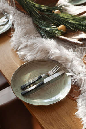 Dining table with setting for Christmas celebration indoors