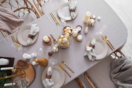 Dining table with setting for Christmas celebration indoors