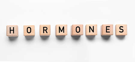 Word HORMONES made of cubes on white backgroundの写真素材
