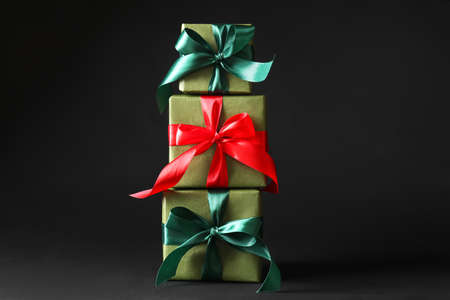 Beautiful Christmas gift boxes on black backgroundの写真素材