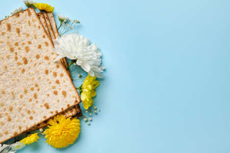 Jewish flatbread with flowers on color backgroundの写真素材
