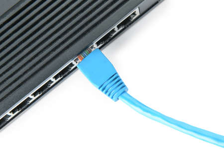 Modern wifi router and internet cable isolated on white background, closeup