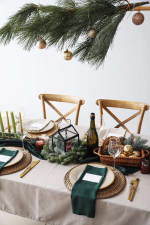 Festive table setting for Christmas celebration in dining room