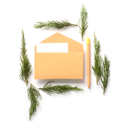 Envelope with Christmas branches on white backgroundの写真素材