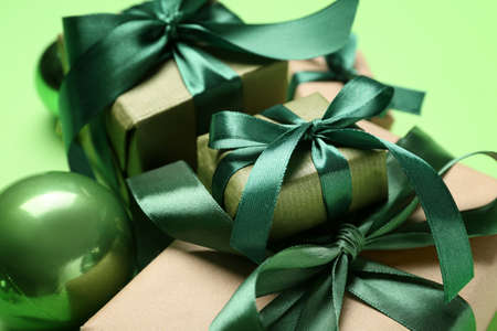 Beautiful Christmas gifts on green background, closeupの写真素材