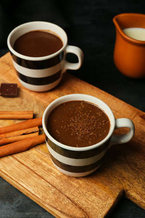 Cups of natural hot chocolate on black backgroundの写真素材