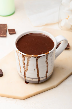 Cup of natural hot chocolate on white backgroundの写真素材
