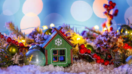 Beautiful Christmas composition on snow against blurred lights, closeupの写真素材