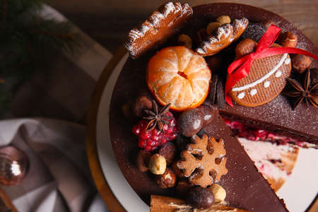 Stand with tasty Christmas chocolate cake on table, closeupの写真素材