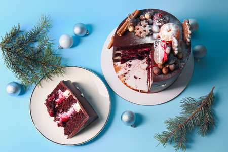 Composition with tasty Christmas chocolate cake on blue backgroundの写真素材