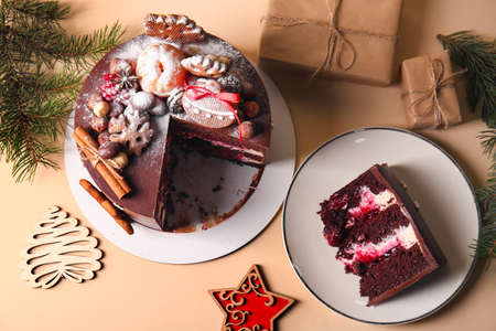 Composition with tasty Christmas chocolate cake on beige background