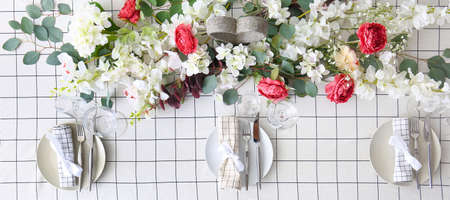 Beautiful festive table setting with floral decor, top viewの写真素材