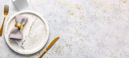 Beautiful table setting on light background with space for textの写真素材