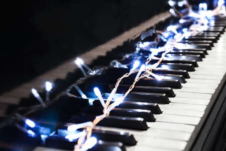 Glowing lights on piano keys, closeupの写真素材