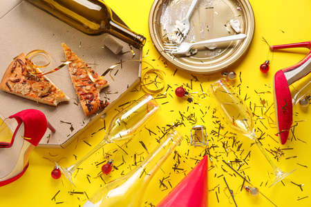 Composition of after party mess on color background. christmas celebrationの写真素材