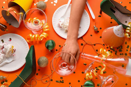 Composition of after party mess on color background. christmas celebrationの写真素材