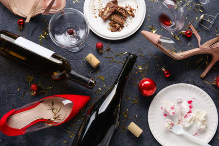 Composition of after party mess on dark background. christmas celebrationの写真素材