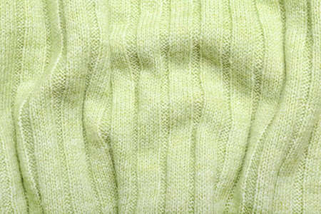Texture of green crumpled fabric as background