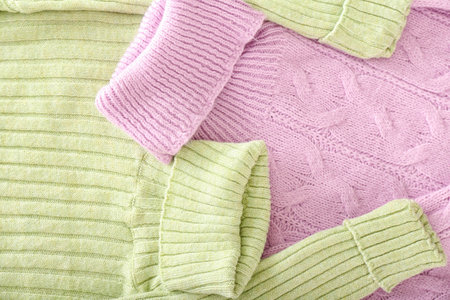 Knitted roll-neck sweaters as background