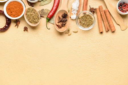Composition with different aromatic spices on color background