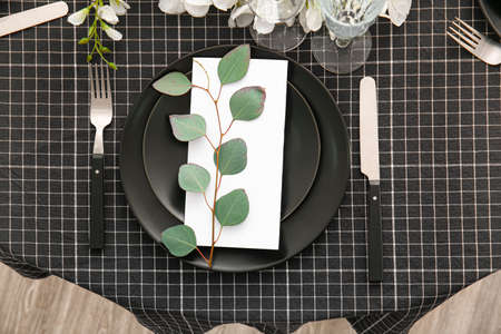 Stylish table setting with wedding invitationの写真素材