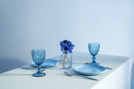 Stylish table setting in blue colors
